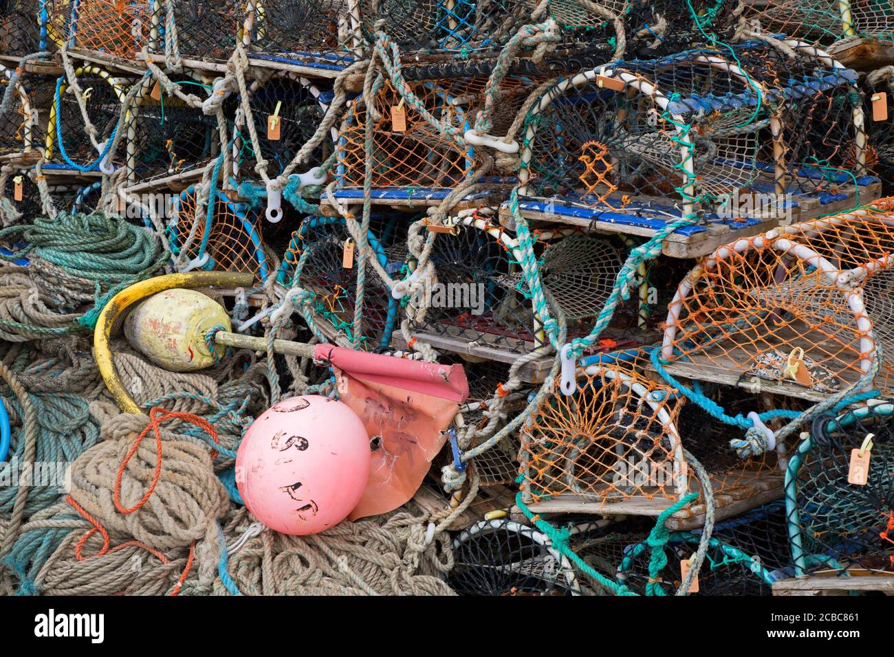 Lobster pots and fishing ropes in a pile, Beadnell, Northumberland, UK Stock Photo