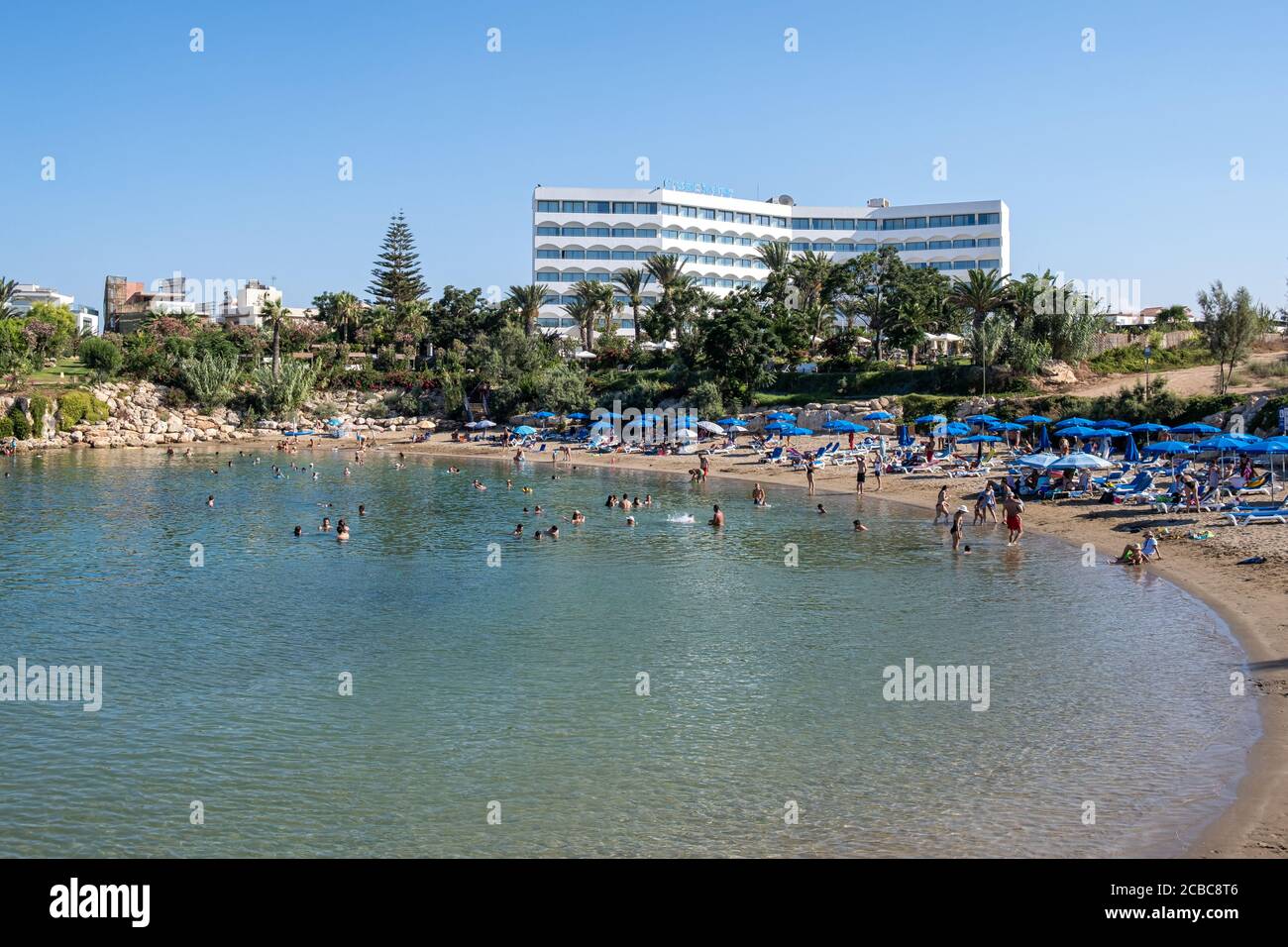 Idyllic tropical beach with tourists during summertime Stock Photo