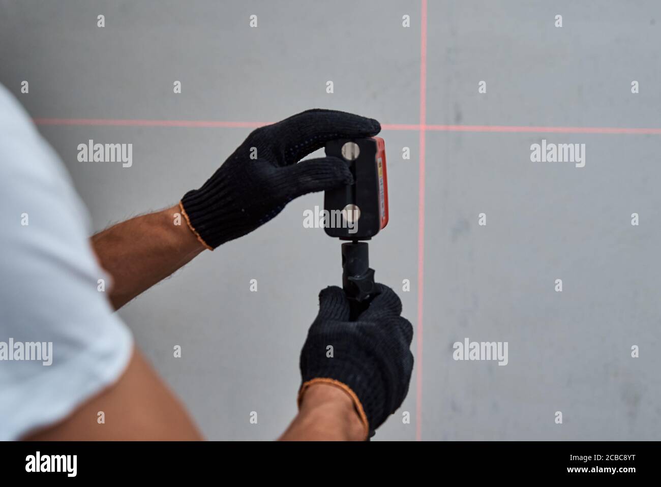 Male worker using laser level. Renovation concept Stock Photo