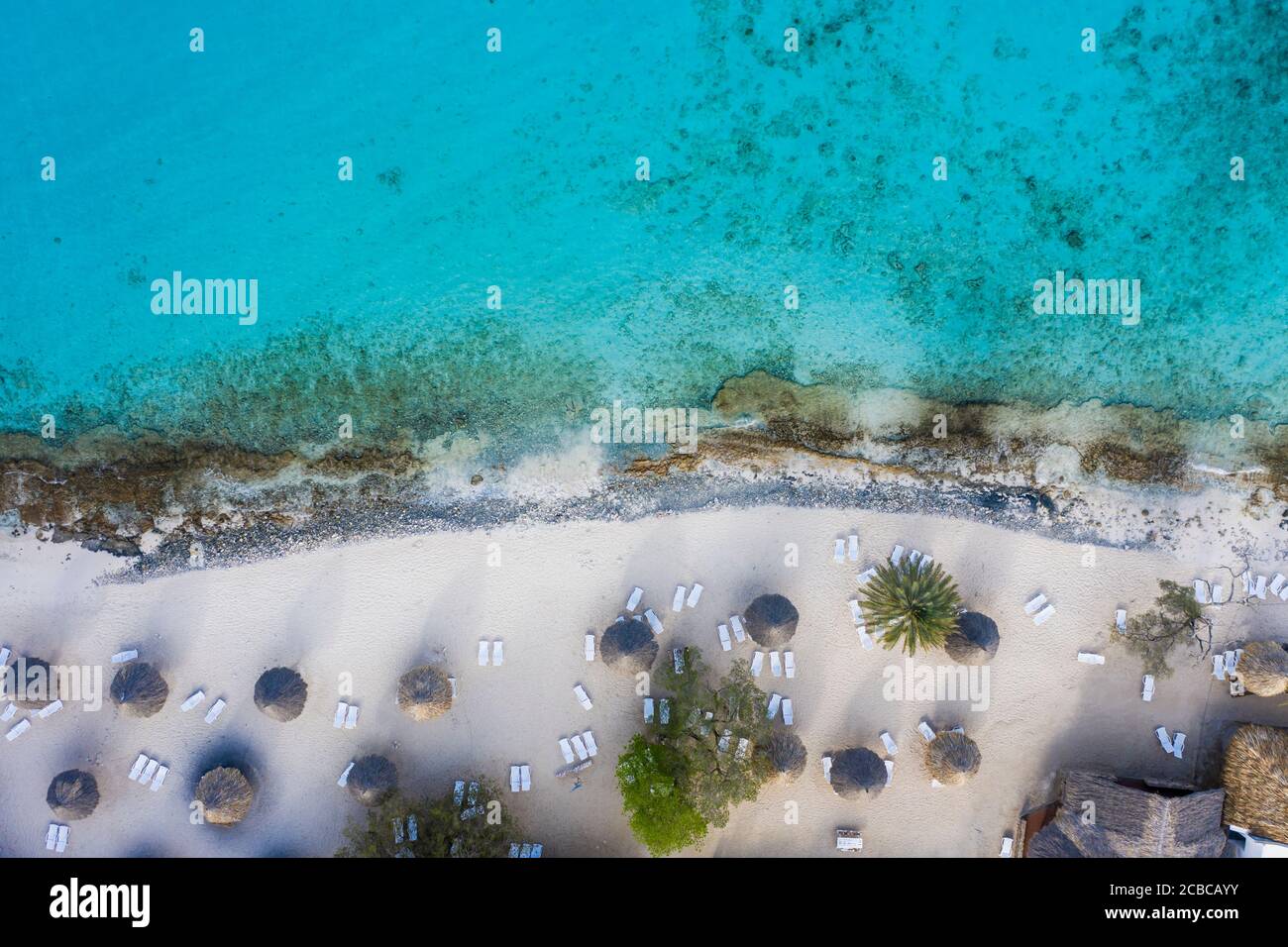 Aerial view of coast of Curaçao in the Caribbean Sea with turquoise water, cliff, beach and beautiful coral reef Stock Photo