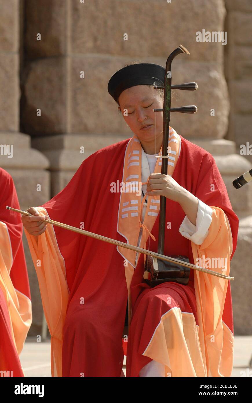 Austin, Texas USA, July 14, 2006: A Taoist monk from the Wudang Mountain monastery in China plays a Zhonghu, a bowed stringed instrument, at the Texas Capitol for tourists during a week-long fund-raising tour of the U.S. The visit aims to share the cultural arts of the Taoist Chinese religion that dates to the Han Dynasty of the second century AD. ©Bob Daemmrich Stock Photo