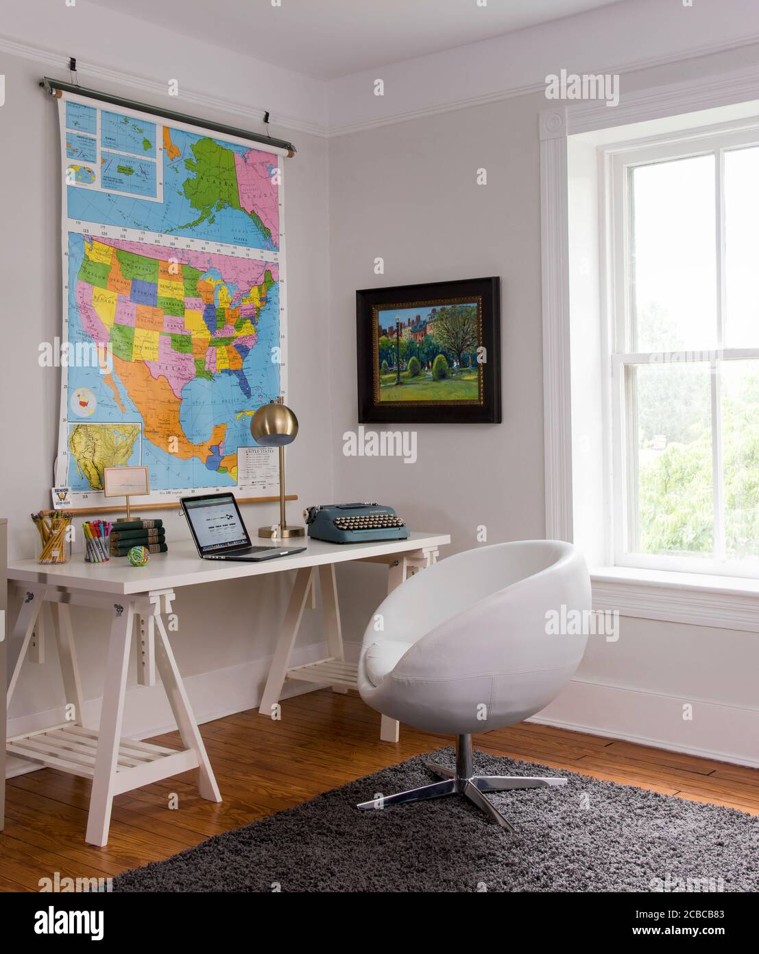 Desk in home, Map on Wall Stock Photo