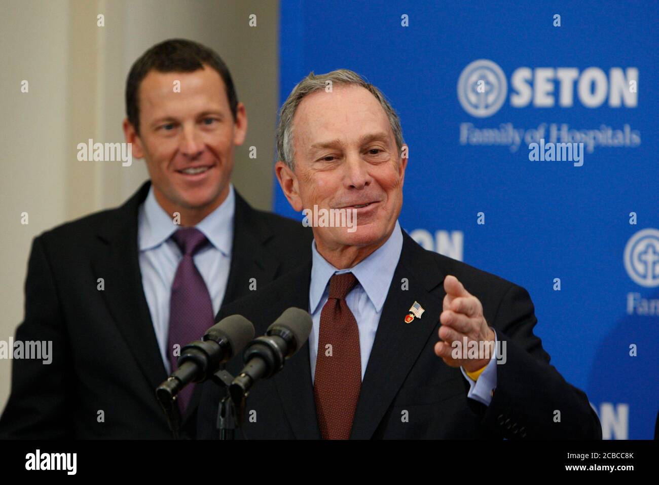 Austin, Texas USA, January 18, 2008: New York City Mayor Michael Bloomberg speaks to reporters about a new cancer health initiative as professional cyclist, cancer survivor and initiative supporter Lance Armstrong listens.  ©Bob Daemmrich Stock Photo