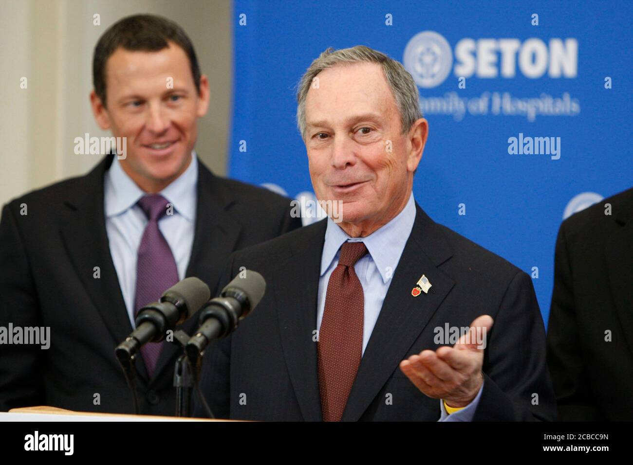 Austin, Texas USA, January 18, 2008: New York City Mayor Michael Bloomberg speaks to reporters about a new cancer health initiative as professional cyclist, cancer survivor and initiative supporter Lance Armstrong listens.  ©Bob Daemmrich Stock Photo
