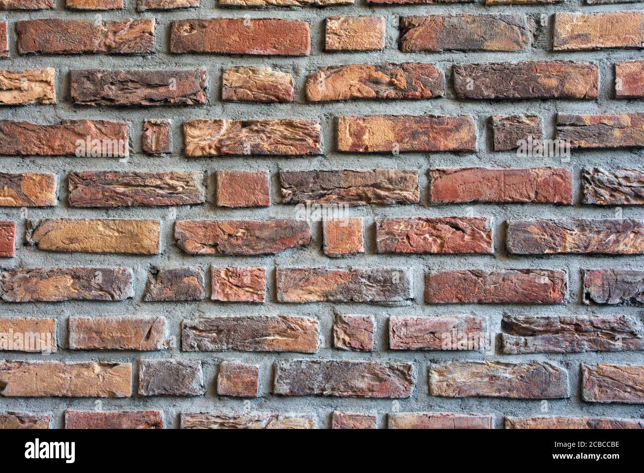 Brick wall dark red colored for background texture, modern retro style Stock Photo