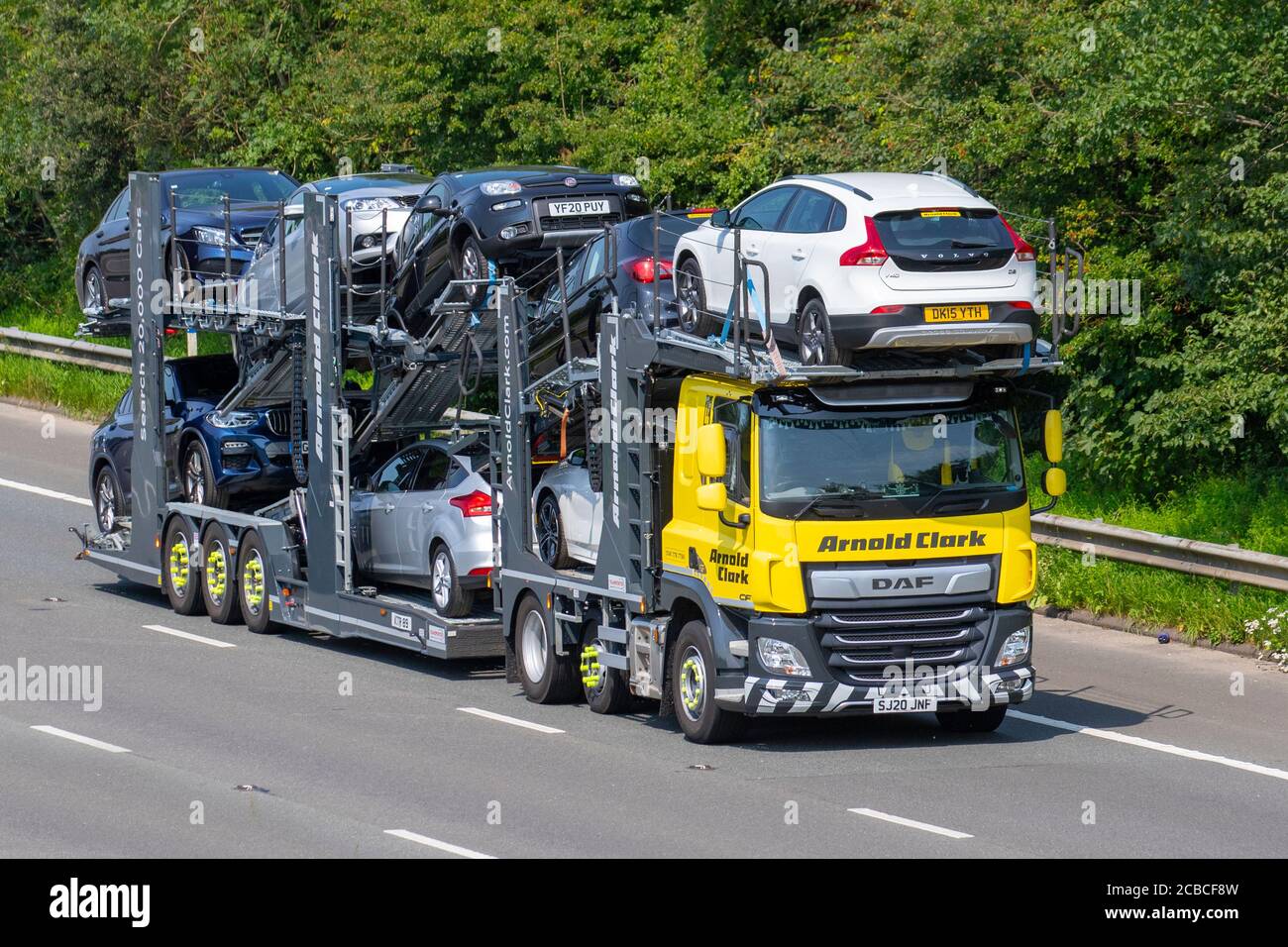 Arnold Clark second hand Vehicle deliveries; Car Transporter Vehicle Transport. Commercial car transporter vehicles on the M6 at Lancaster. UK Stock Photo