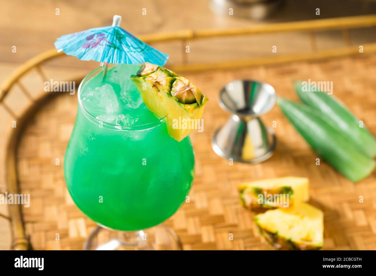 Boozy Refreshing Blue Hawaii Cocktail with PIneapple and Curacao Stock Photo