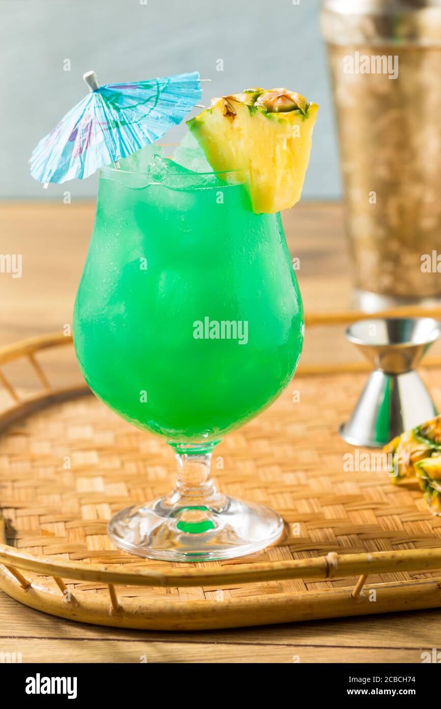 Boozy Refreshing Blue Hawaii Cocktail with PIneapple and Curacao Stock Photo