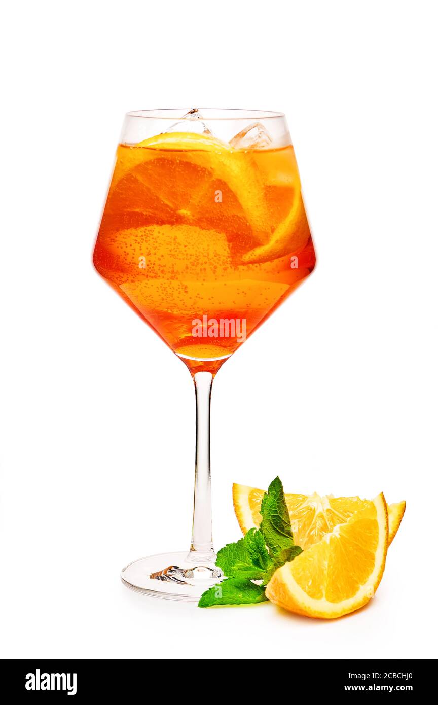 Glass of aperol spritz cocktail with orange slices isolated on white background Stock Photo