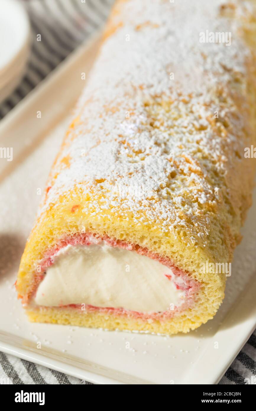 Homemade Frozen Artic Roll Cake with Ice Cream and Strawberries Stock Photo