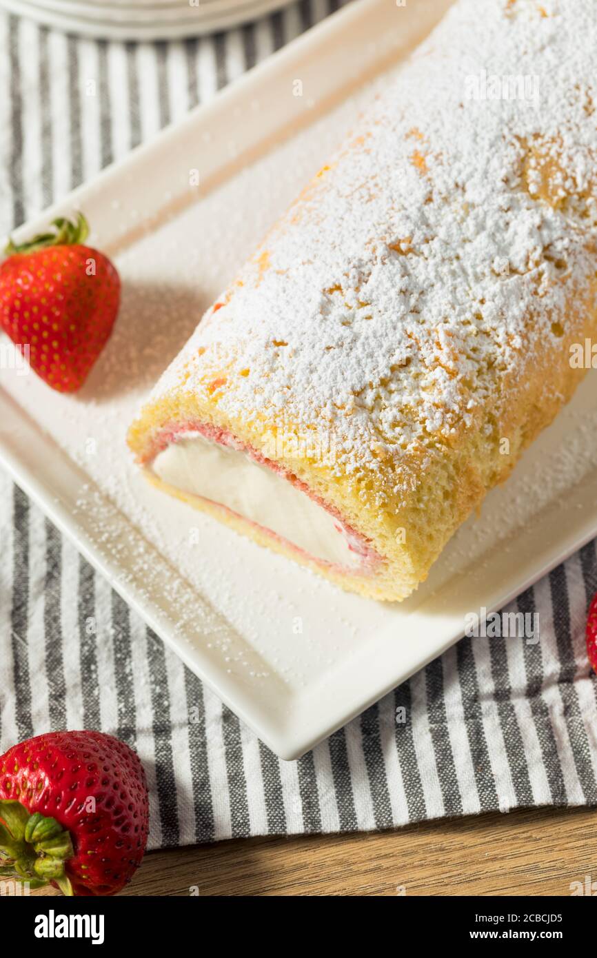 Homemade Frozen Artic Roll Cake with Ice Cream and Strawberries Stock Photo