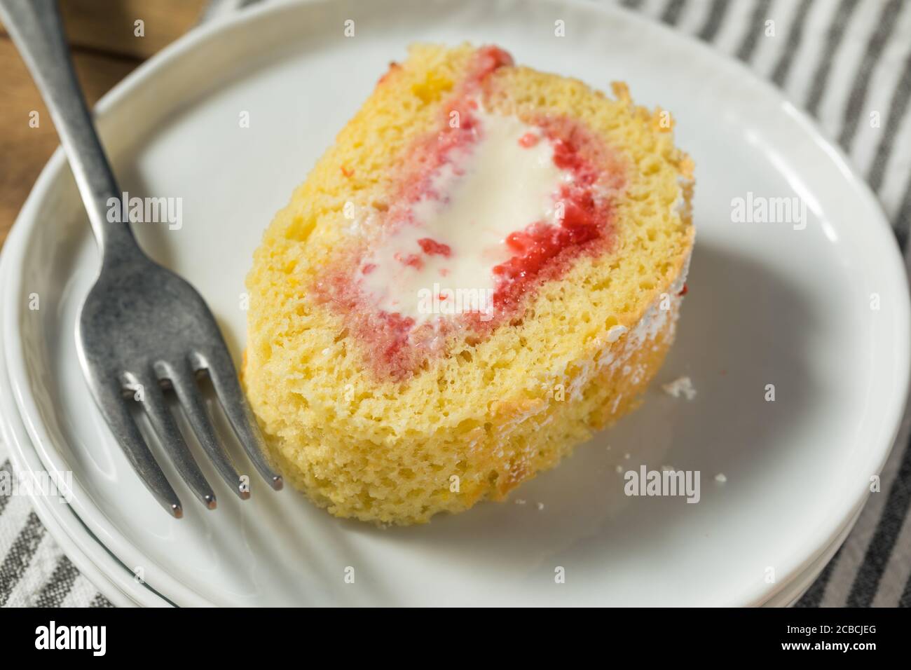 Homemade Frozen Artic Roll Cake with Ice Cream and Strawberries Stock Photo