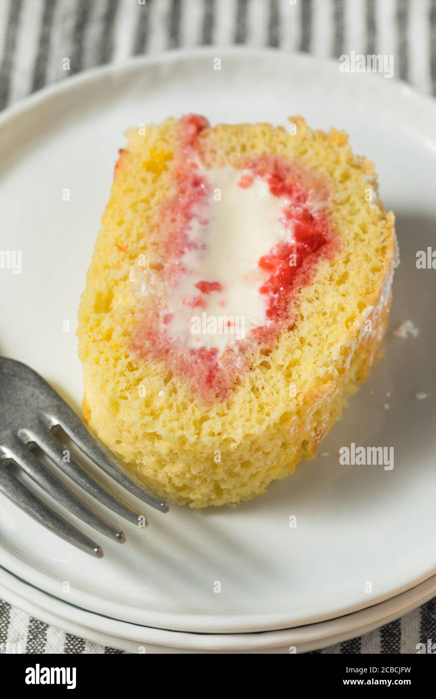 Homemade Frozen Artic Roll Cake with Ice Cream and Strawberries Stock Photo