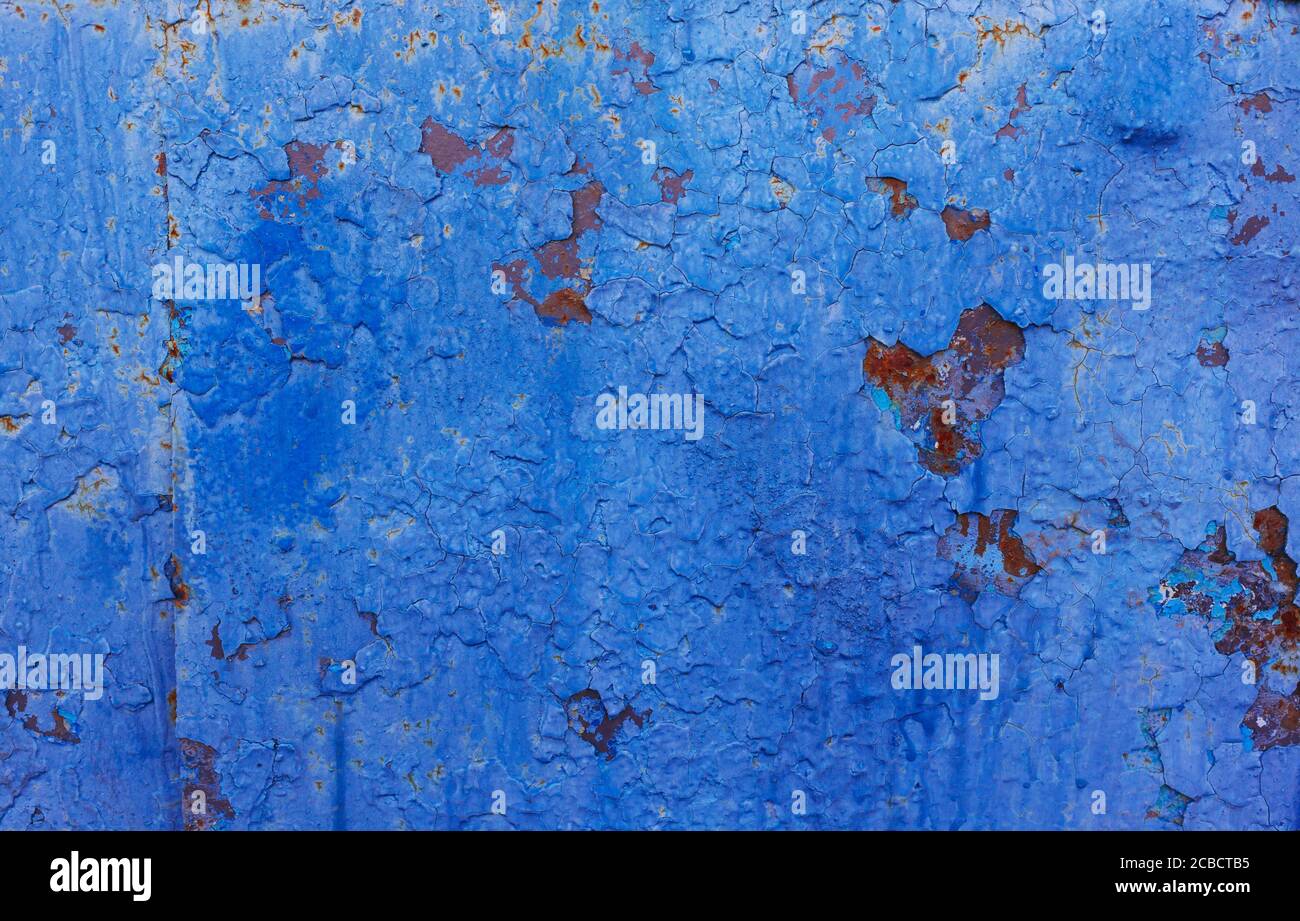 Rusty blue abstract texture, metallic door with shabby blue paint background, painted metal with rust Stock Photo