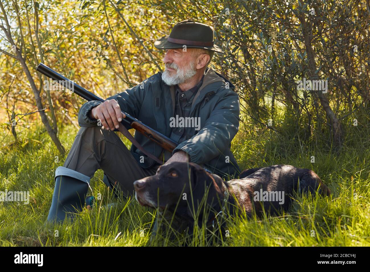 Old Man Hunting With His Dog High Resolution Stock Photography and
