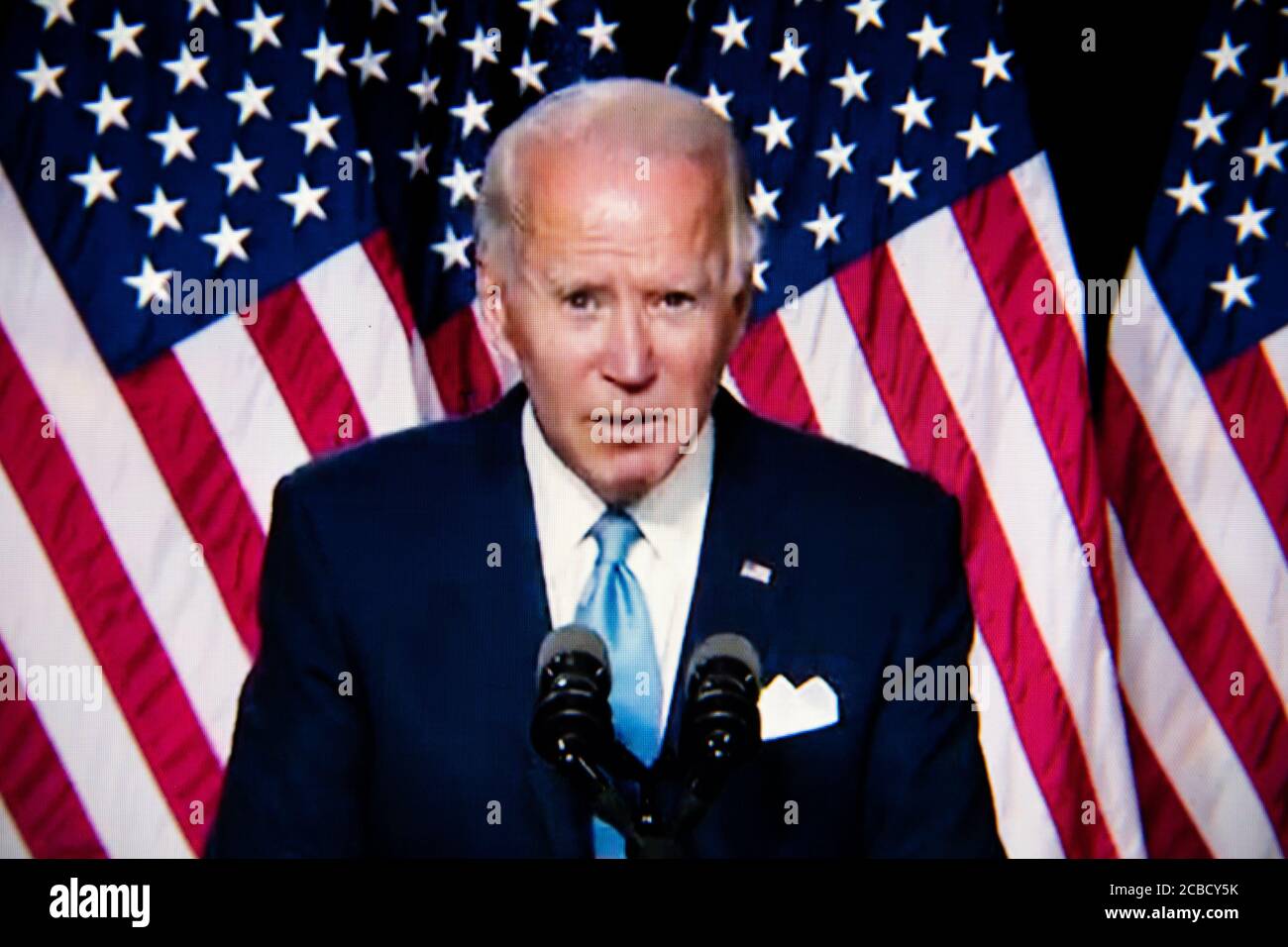Washington, USA. 12th Aug, 2020. A close-up photo illustration of a laptop computer screen shows presumptive Democratic Nominee for President Joe Biden speaking at a livestream event of the announcement of Sen. Kamala Harris as his Vice Presidential running mate, in Washington, DC, on August 12, 2020 amid the Coronavirus pandemic. Sen. Harris is the first woman of color running for Vice President on a major party ticket. (Graeme Sloan/Sipa USA) Credit: Sipa USA/Alamy Live News Stock Photo