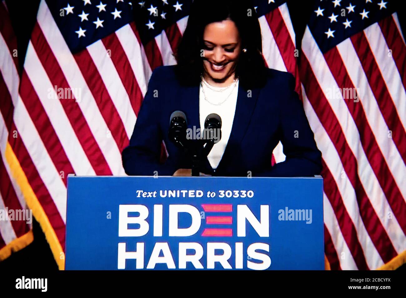 Washington, USA. 12th Aug, 2020. A close-up photo illustration of a laptop computer screen shows Sen. Kamala Harris speaking at a livestream event where presumptive Democratic Nominee for President Joe Biden announced her as his Vice Presidential running mate, in Washington, DC, on August 12, 2020 amid the Coronavirus pandemic. Sen. Harris is the first woman of color running for Vice President on a major party ticket. (Graeme Sloan/Sipa USA) Credit: Sipa USA/Alamy Live News Stock Photo