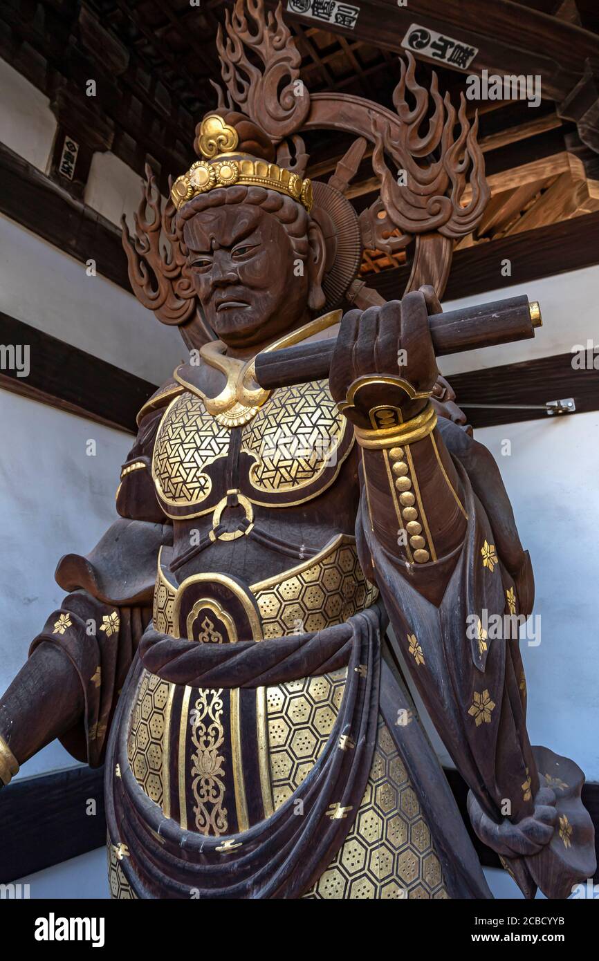 Nankobo is temple No. 55 with a magnificent gate facing the main road, with four fierce guardians decorated with gold leaf.  The daishido is large and Stock Photo