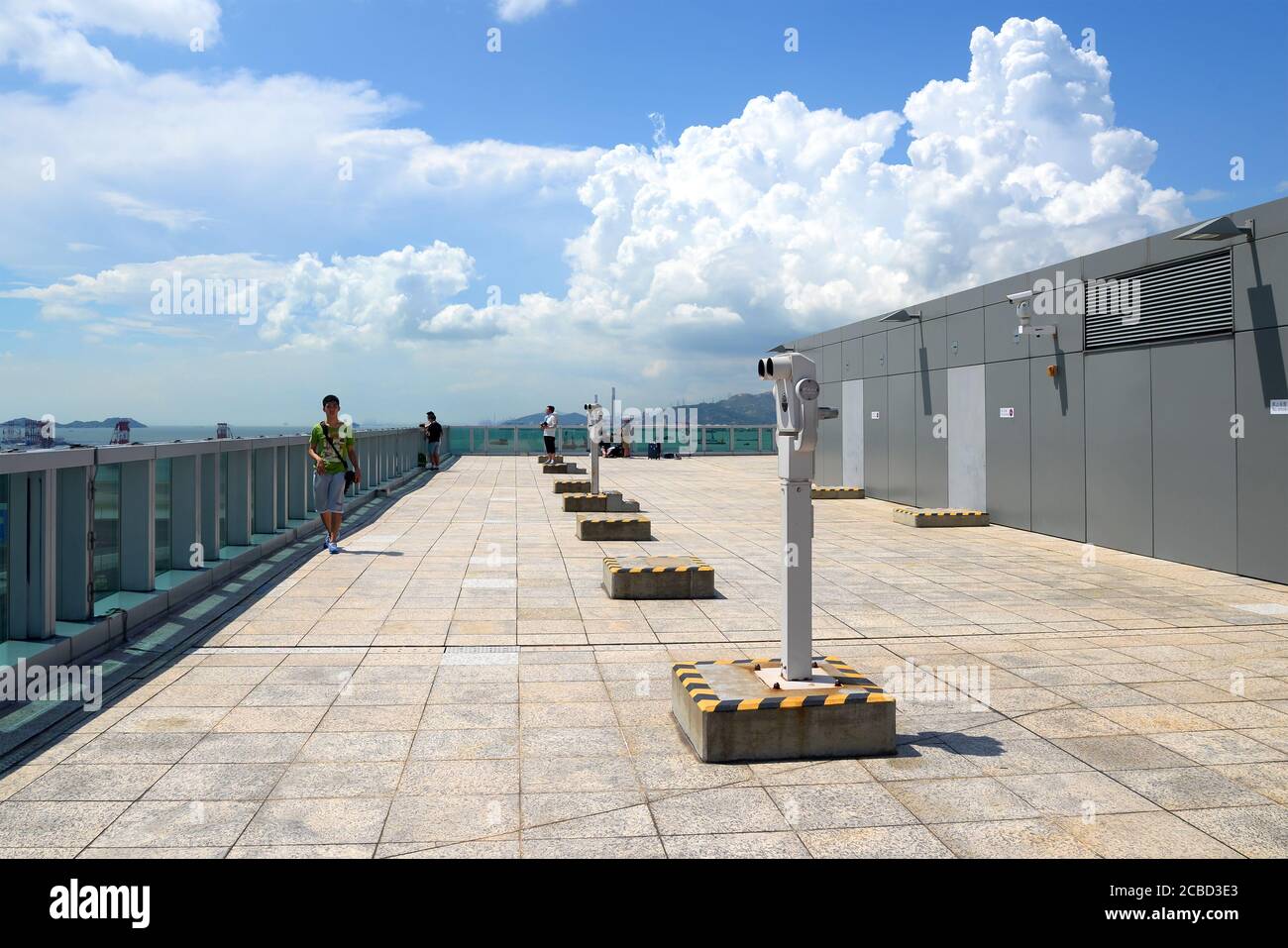 Sky Deck of Hong Kong Airport used for the practice of plane spotting. Observation deck with binoculars at Chek Lap Kok Airport. Stock Photo