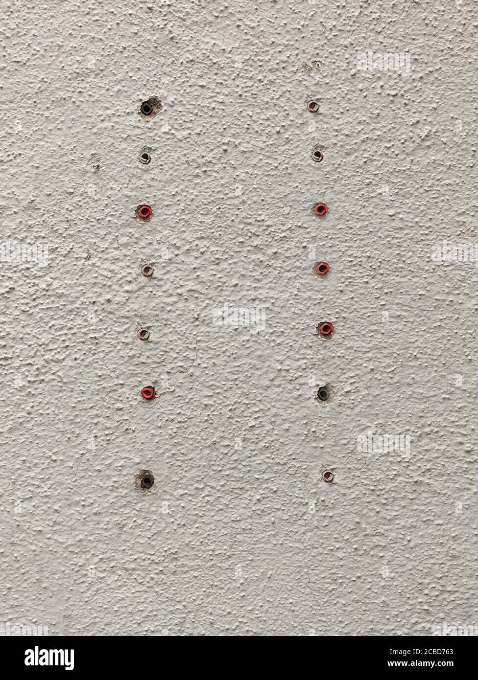 Screws Removed From A Concrete Wall Stock Photo Alamy