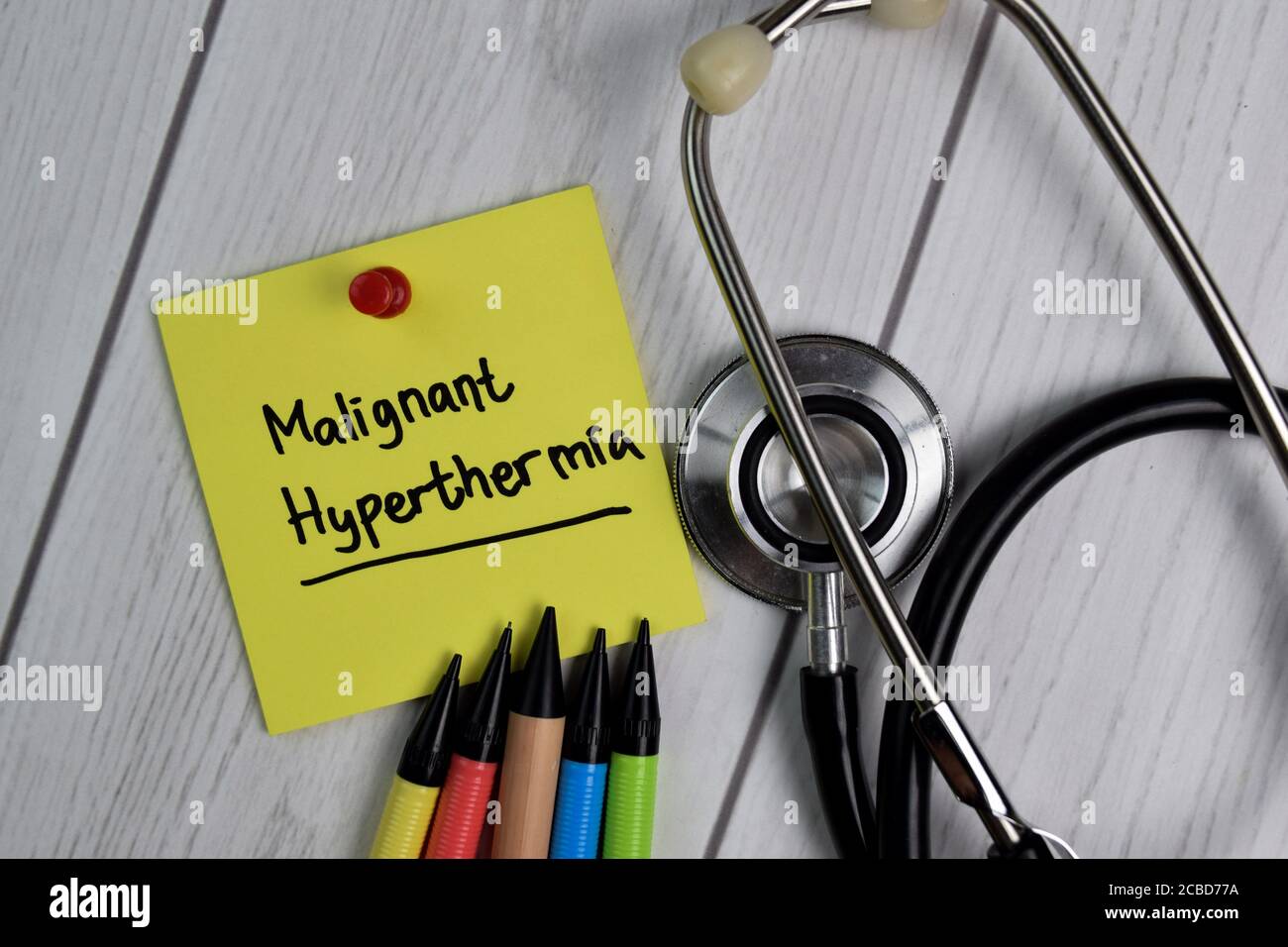 Malignant Hyperthermia text on sticky notes with office desk. Healthcare/Medical concept Stock Photo