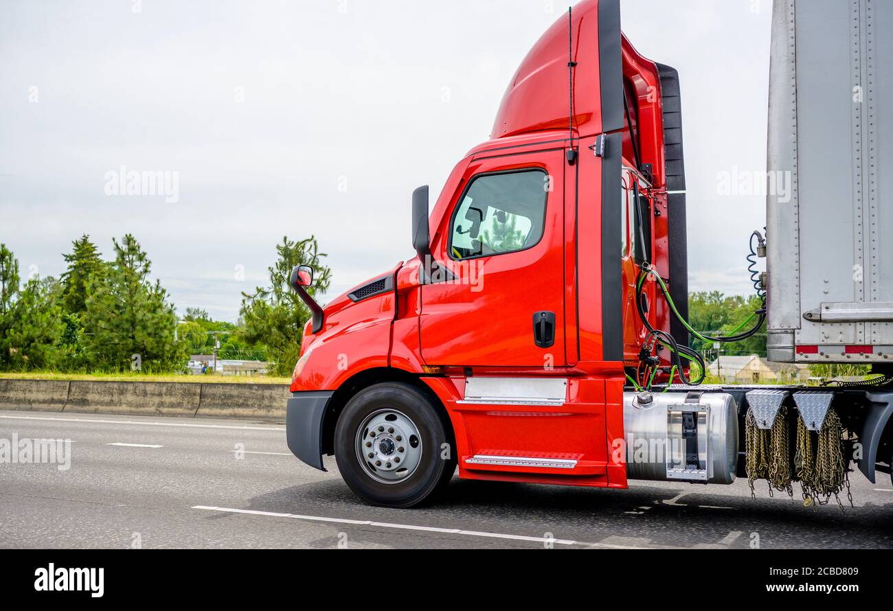 Stylish Heavy loaded classic red big rig semi truck with roof spoiler  transporting commercial cargo at dry van semi trailer running on the  straight wi Stock Photo - Alamy