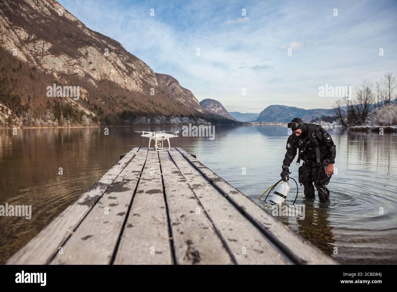Drone Crash - Diver Standing Next to a Retrieved Drone Stock Photo