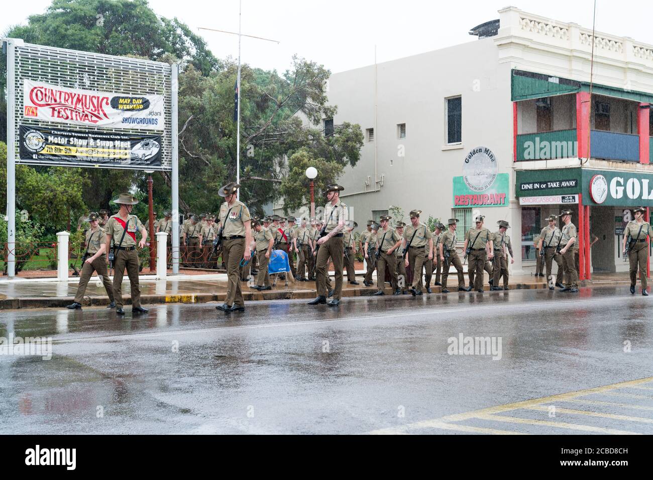 Charters Towers, Australia - April 25, 2019: Soldiers of the 1st Battalion, Royal Australian Regiment preparing to march in the rain on Anzac Day Stock Photo