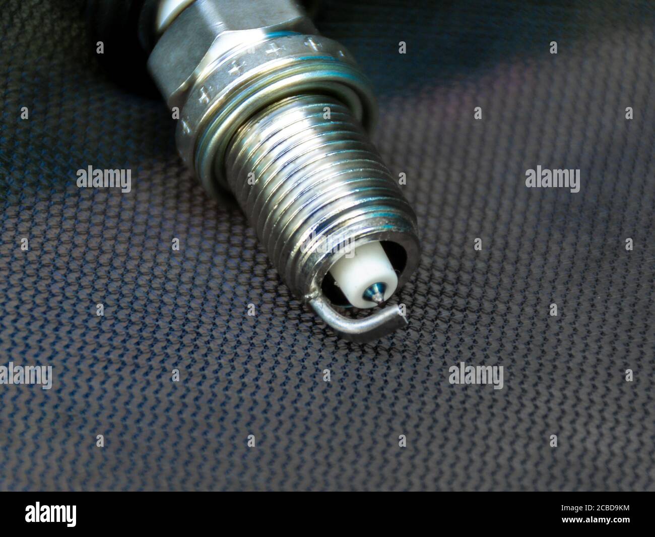 new spark plug, thread close-up, selective focus Stock Photo