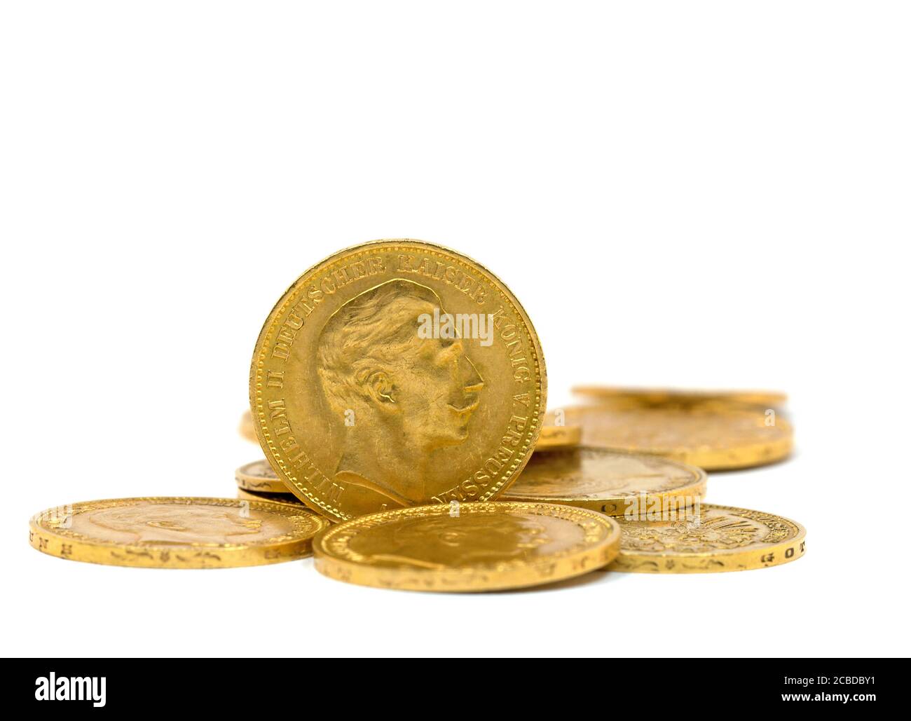 Old German gold coins against a white background Stock Photo