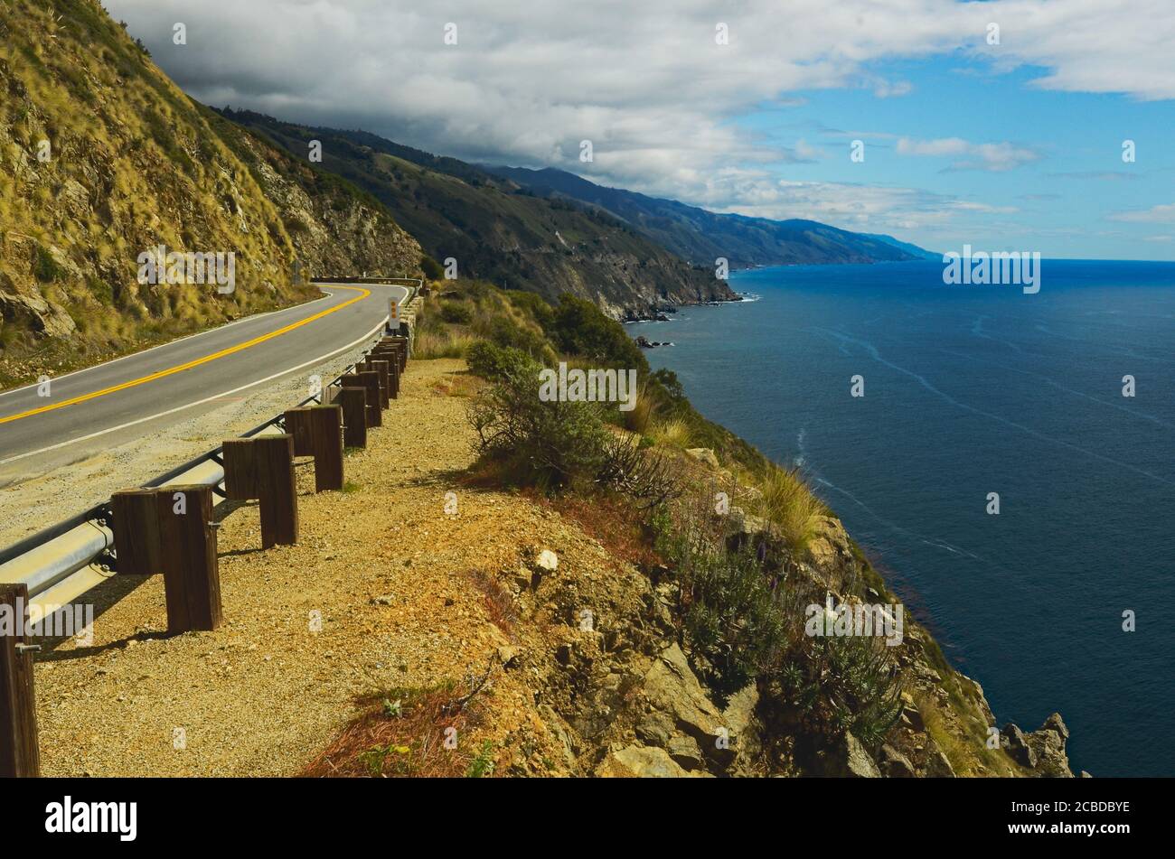 Wonder of nature, scenic panoramic of central California coast, near Big Sur, with curvy road, vivid color of mountains-coastline inspiring vista. Stock Photo
