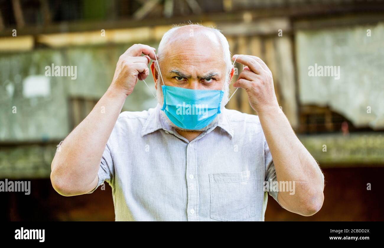 Old man wearing face mask. Portrait of an old man, years old, in a ...