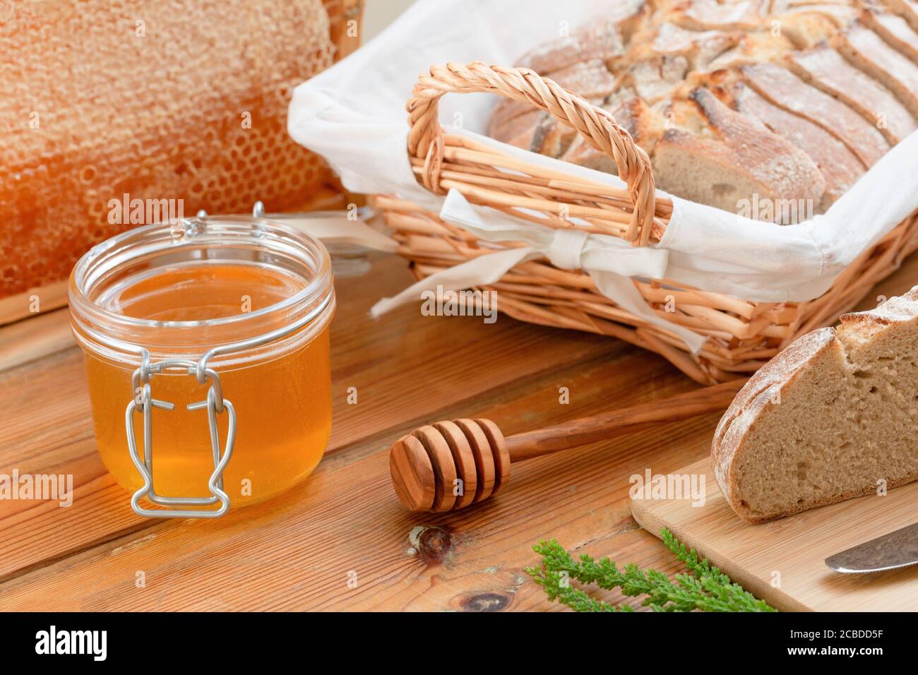 organic honey and rustic bread on a old wooden table. Healthy eating breakfast. Stock Photo