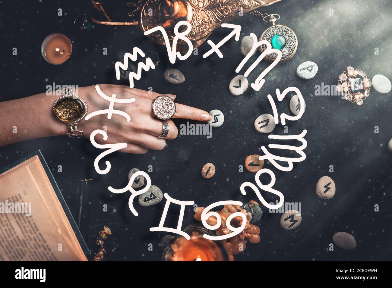 rune stones with black symbols for fortune telling Stock Photo - Alamy