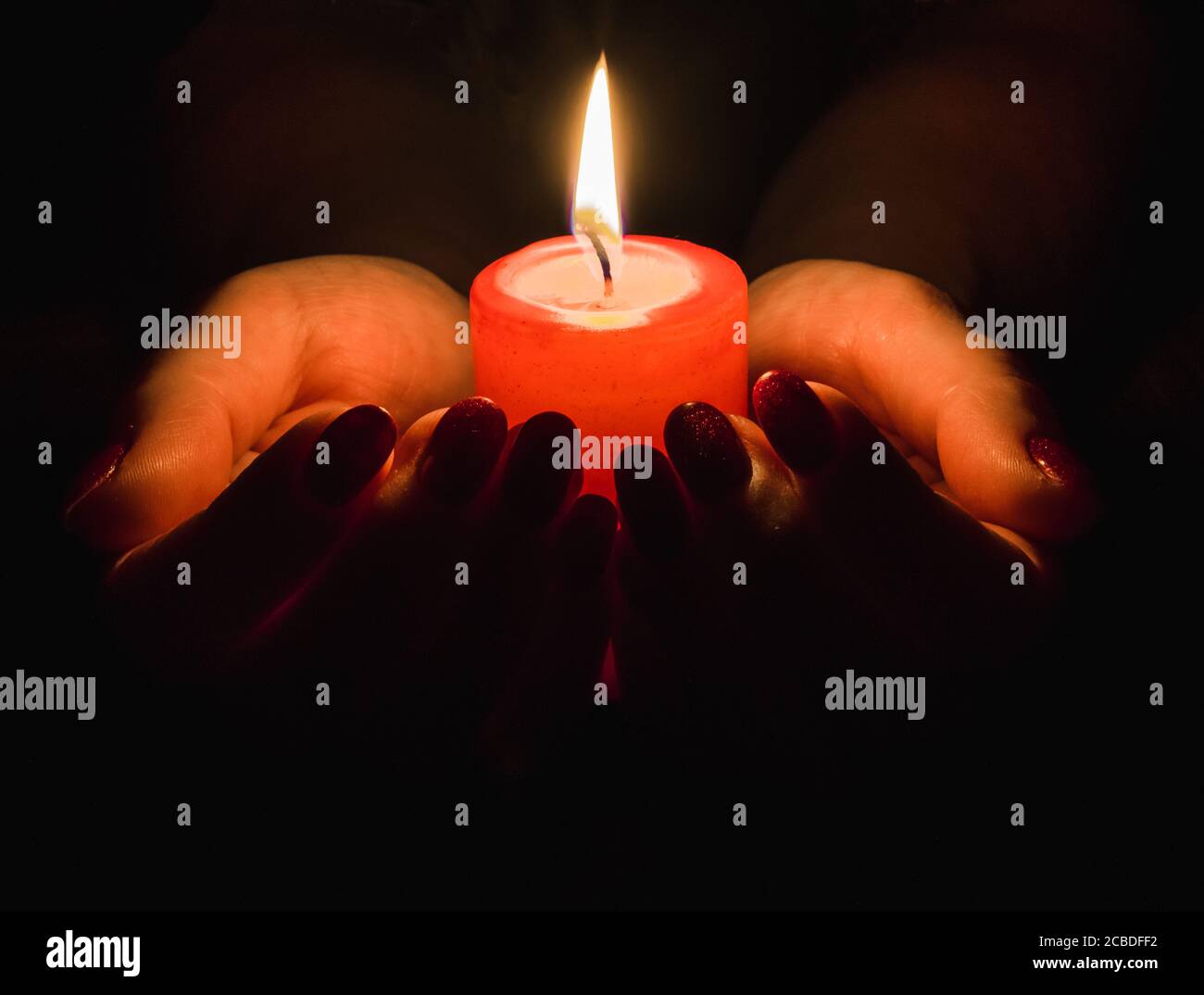 Holding burning candle in hand hires stock photography and images Alamy