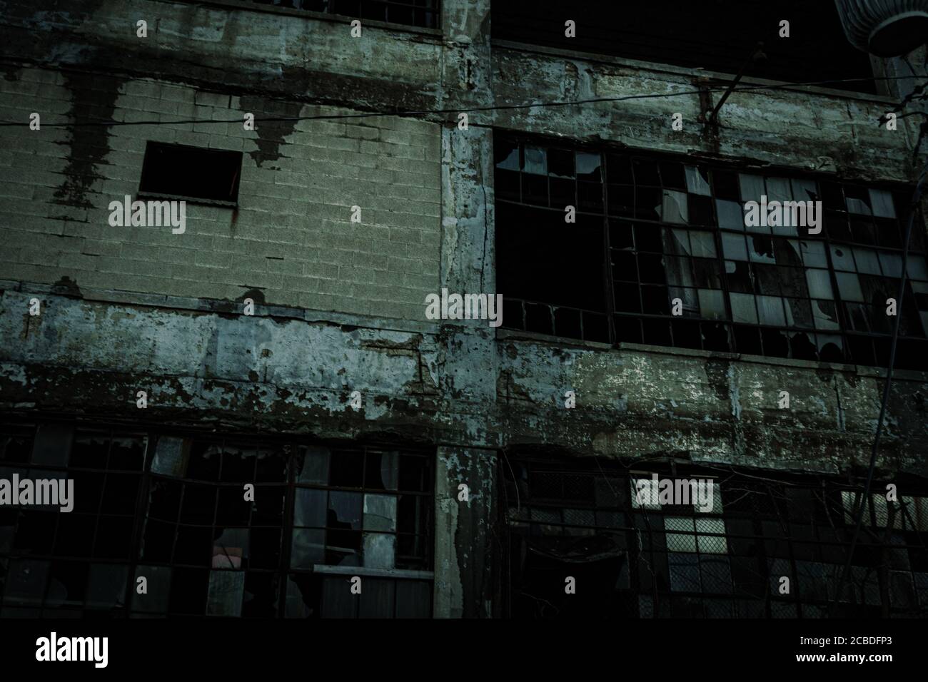 Low angle shot of an abandoned building in a dark environment Stock ...