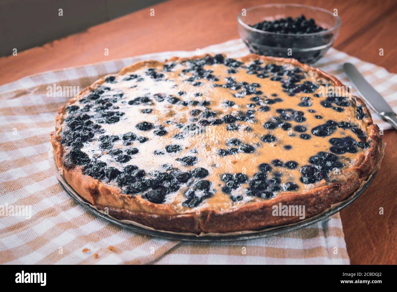 Sweet pastries, Blueberry pie on wooden table, top view. Stock Photo