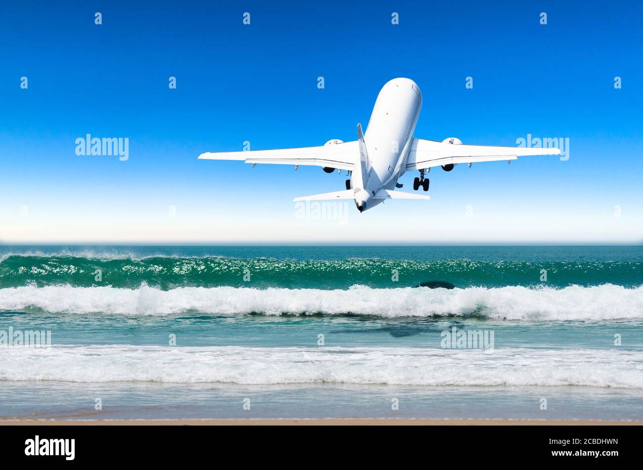 Passenger plane landing over beach hi-res stock photography and images ...
