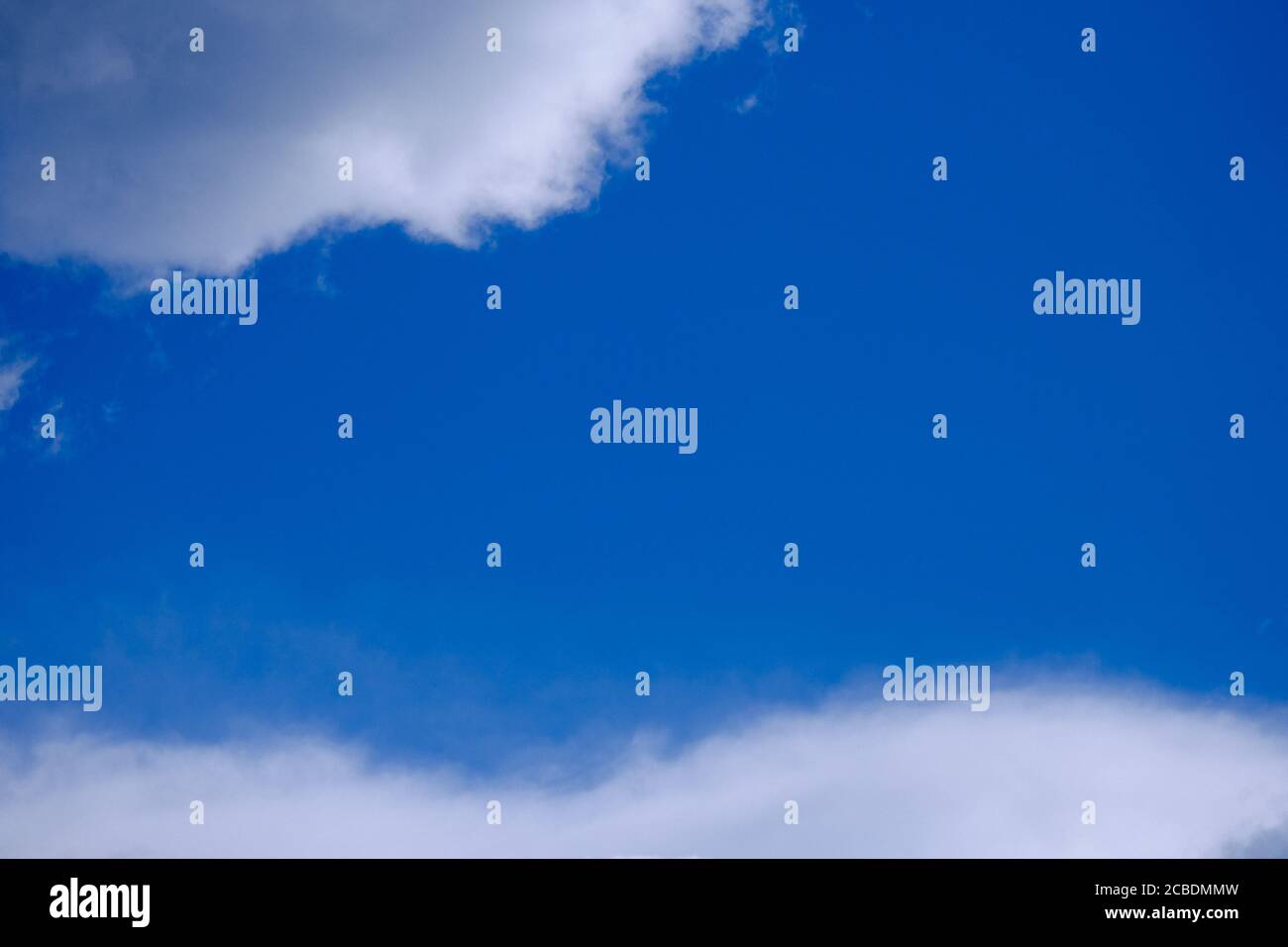 Low angle shot of a cloudy blue sky - perfect for background Stock ...