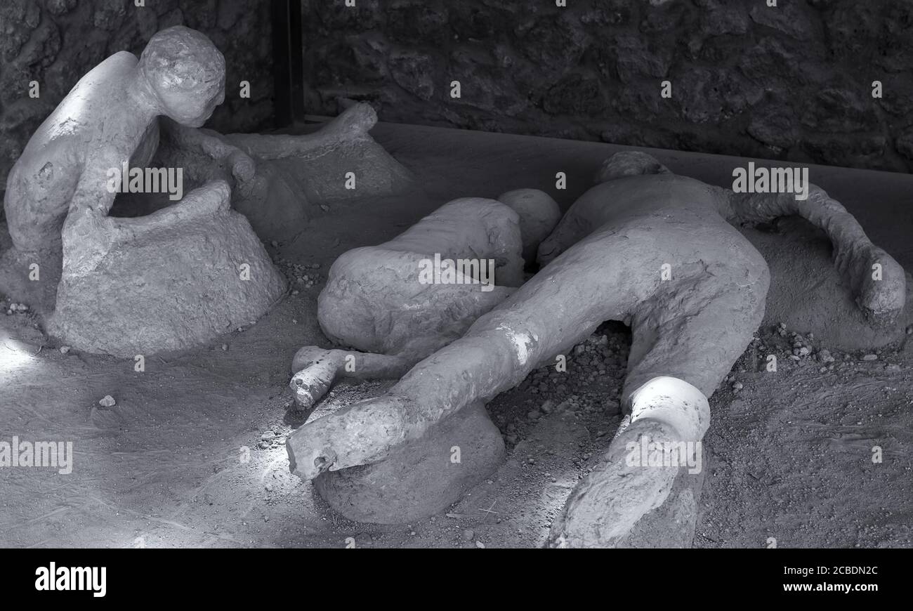 A plaster cast of victims in last moments of the eruption of the volcano Vesuvius 79 BC. Pompeii, Italy Stock Photo