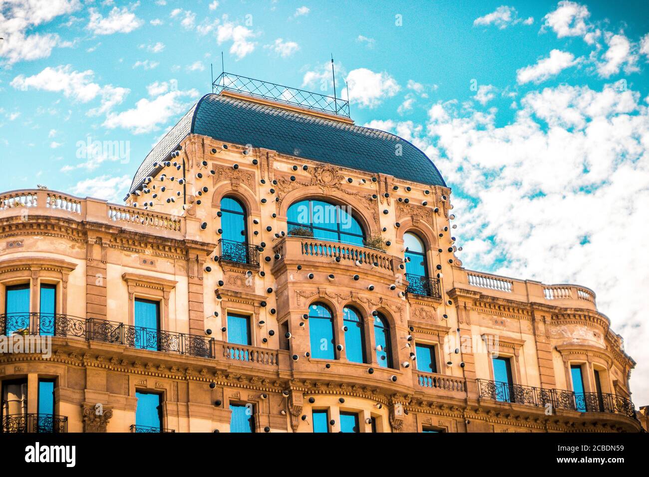 Low angle shot of a facade of a beautiful building under a cloudy sky ...