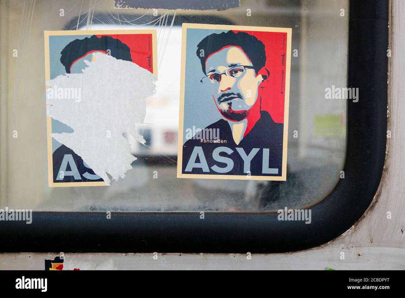 A couple of Edward Snowden ASYL stickers in the style of Shepard Fairy's Obama HOPE poster. In Vienna, Austria. Stock Photo