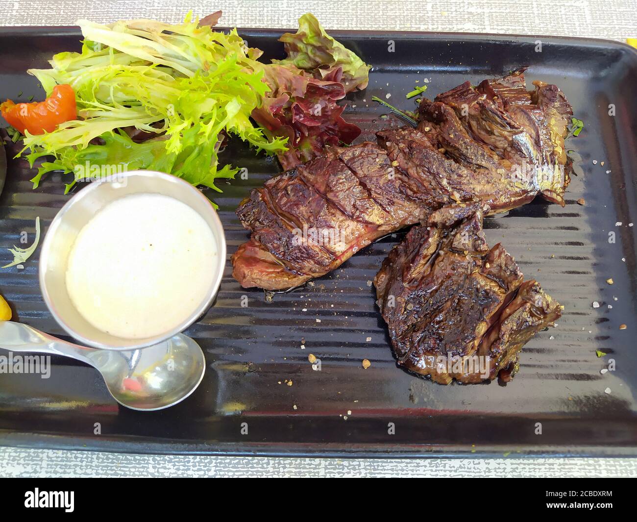 grilled beef steak and salad Stock Photo - Alamy
