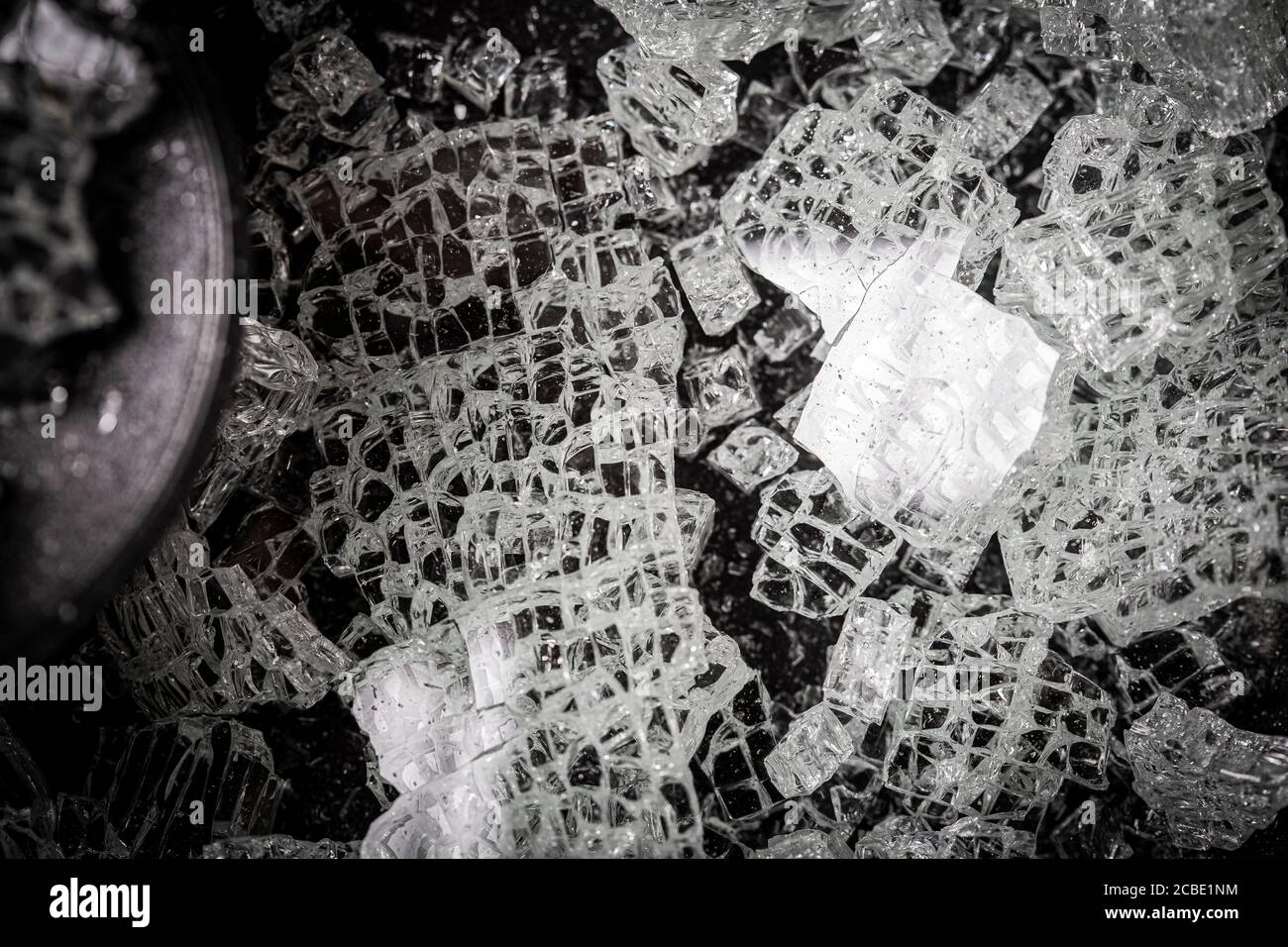 Broken glass texture on a black background Stock Photo