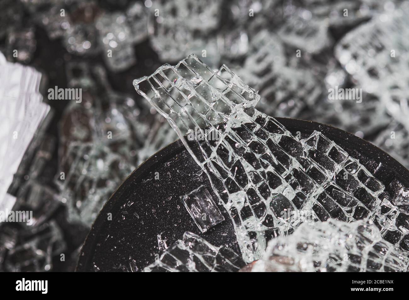 Broken glass texture on a black background Stock Photo