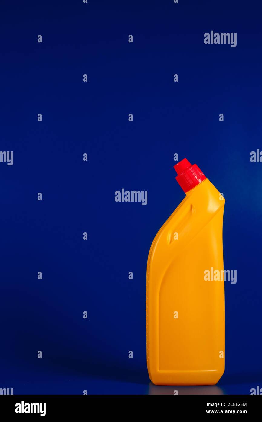 yellow toilet cleaner on a blue background Stock Photo - Alamy