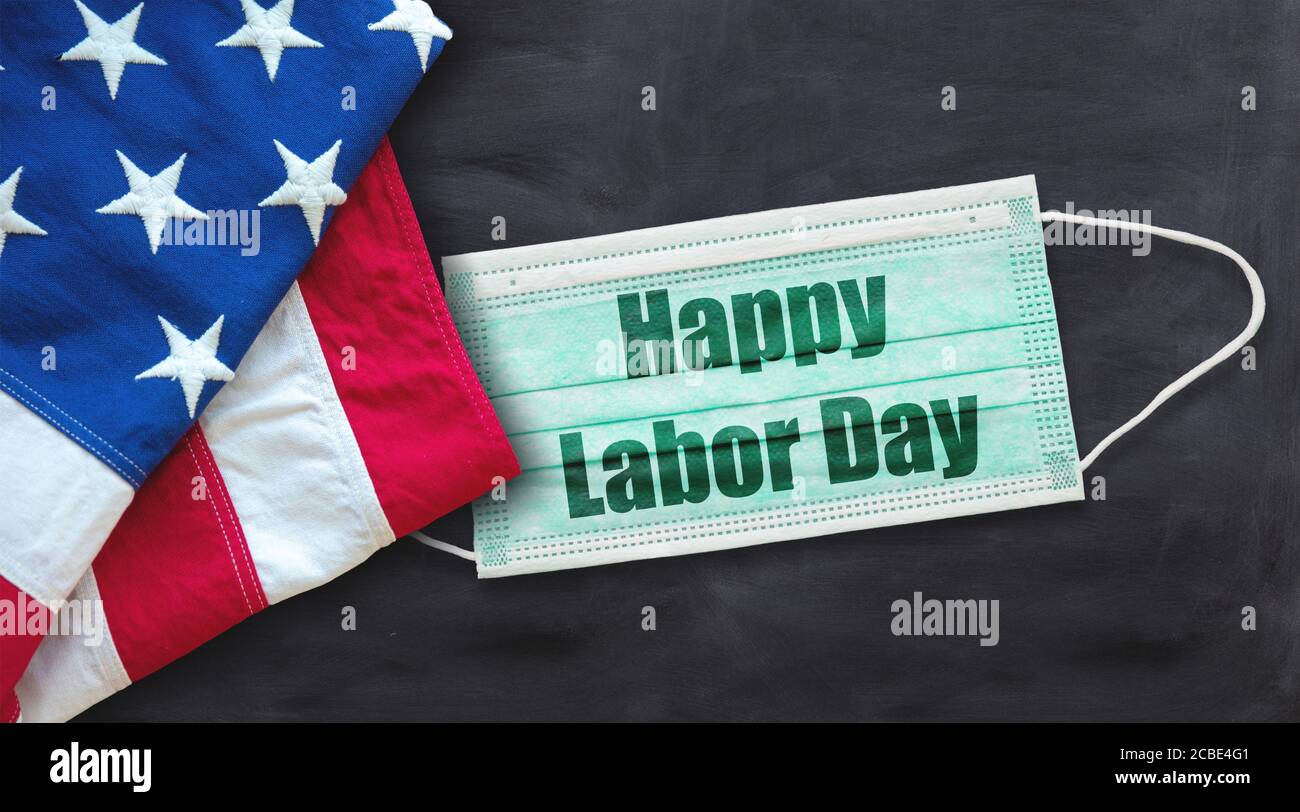 Happy Labor Day 2020, coronavirus time. National american holiday, USA flag, covid19 protective mask with text on black color background. Festive post Stock Photo