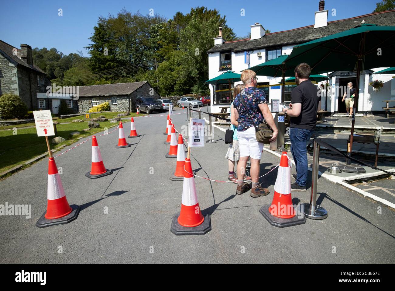 measures put in place for social distancing outside a the britannia inn pub during the covid-19 coronavirus outbreak in the lake district cumbria engl Stock Photo