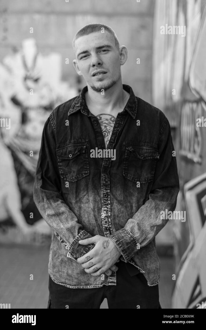 Young caucasian man black shirt Black and White Stock Photos & Images ...