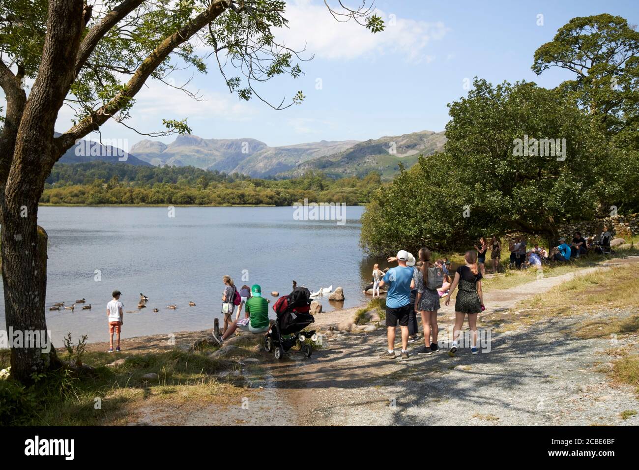 people on day trips and staycation holidays on elterwater lake district cumbria england uk Stock Photo